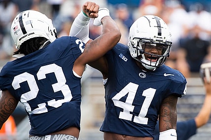 Penn State linebackers Kobe King (41) and Curtis Jacobs (23) get pumped up before facing off against Delaware Saturday, Sept. 9, 2023, in State College, Pa.