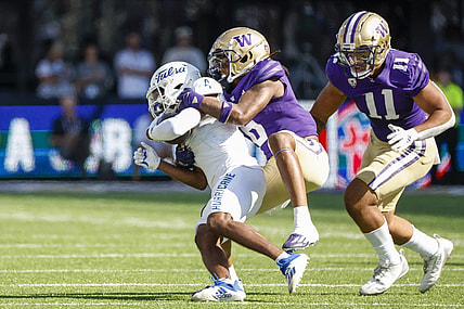 Sep 9, 2023; Seattle, Washington, USA; Washington Huskies cornerback Davon Banks (6) tackles Tulsa Golden Hurricane wide receiver Marquis Shoulders (4) following a second quarter reception at Alaska Airlines Field at Husky Stadium. Mandatory Credit: Joe Nicholson-USA TODAY Sports