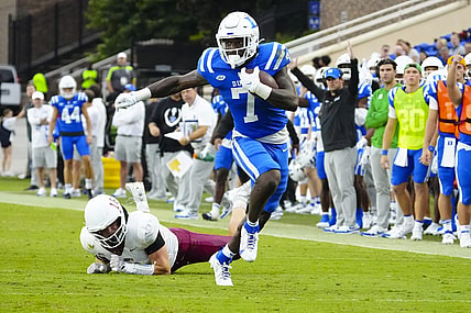 Sep 9, 2023; Durham, North Carolina, USA;  Duke Blue Devils running back Jordan Waters (7) makes a catch past Lafayette Leopards linebacker Preston Forney (18) during the first half at Wallace Wade Stadium. Mandatory Credit: James Guillory-USA TODAY Sports