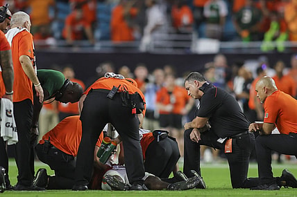 Sep 9, 2023; Miami Gardens, Florida, USA; Miami Hurricanes head coach Mario Cristobal looks on as trainers check on Miami Hurricanes safety Kamren Kinchens (5) after an injury against the Texas A&M Aggies during the fourth quarter at Hard Rock Stadium. Mandatory Credit: Sam Navarro-USA TODAY Sports
