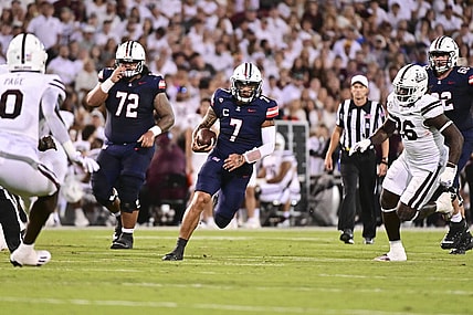 Sep 9, 2023; Starkville, Mississippi, USA; Arizona Wildcats quarterback Jayden de Laura (7) runs the ball against the Mississippi State Bulldogs during the second quarter at Davis Wade Stadium at Scott Field. Mandatory Credit: Matt Bush-USA TODAY Sports