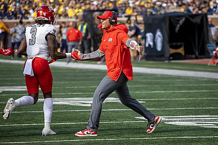 Sep 9, 2023; Ann Arbor, Michigan, USA; UNLV Rebels Defensive Coordinator/Linebackers Mike Scherer slaps hand with defensive back Johnathan Baldwin (3) after a fourth down stand against the Michigan Wolverines during the first half at Michigan Stadium. Mandatory Credit: David Reginek-USA TODAY Sports