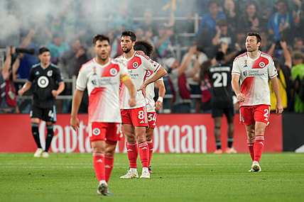 Sep 9, 2023; Saint Paul, Minnesota, USA; New England Revolution midfielder Carles Gil (10) and midfielder Matt Polster (8) and defender Ryan Spaulding (34) and defender Dave Romney (2) react after a game-tying goal by Minnesota United in stoppage time at Allianz Field. Mandatory Credit: Matt Blewett-USA TODAY Sports