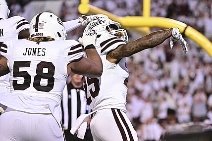 Sep 9, 2023; Starkville, Mississippi, USA; Mississippi State Bulldogs running back Jeffery Pittman (25) reacts teammates after a touchdown against the Arizona Wildcats during overtime at Davis Wade Stadium at Scott Field. Mandatory Credit: Matt Bush-USA TODAY Sports