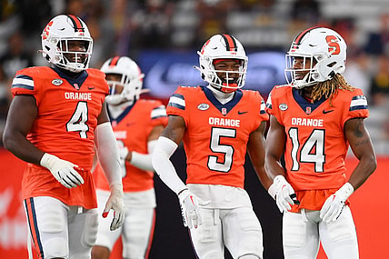 Sep 9, 2023; Syracuse, New York, USA; Syracuse Orange defensive lineman Caleb Okechukwu (4) and defensive back Alijah Clark (5) and defensive back Jason Simmons Jr. (14) reacts to a play against the Western Michigan Broncos during the second half at the JMA Wireless Dome. Mandatory Credit: Rich Barnes-USA TODAY Sports