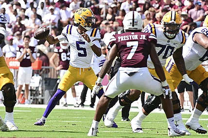 Sep 16, 2023; Starkville, Mississippi, USA; LSU Tigers quarterback Jayden Daniels (5) makes a pass against the Mississippi State Bulldogs during the first quarter at Davis Wade Stadium at Scott Field. Mandatory Credit: Matt Bush-USA TODAY Sports