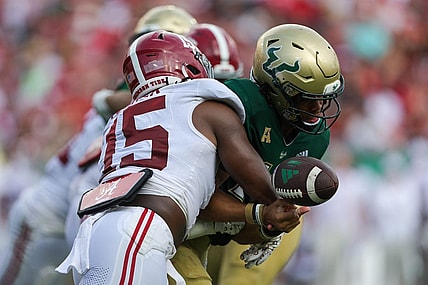 Sep 16, 2023; Tampa, Florida, USA;  *Alabama Crimson Tide linebacker Dallas Turner (15) forces a fumble by South Florida Bulls quarterback Byrum Brown (17) in the second quarter at Raymond James Stadium. Mandatory Credit: Nathan Ray Seebeck-USA TODAY Sports