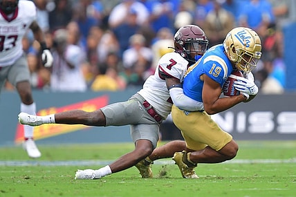 Sep 16, 2023; Pasadena, California, USA; UCLA Bruins wide receiver Kyle Ford (19) is brought down by North Carolina Central Eagles defensive back JaJuan Hudson (7) during the first half at Rose Bowl. Mandatory Credit: Gary A. Vasquez-USA TODAY Sports