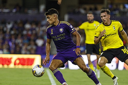 Sep 16, 2023; Orlando, Florida, USA; Orlando City SC forward Ramiro Enrique (7) controls the ball against Columbus Crew defender Malte Amundsen (18) in the first half at Exploria Stadium. Mandatory Credit: Morgan Tencza-USA TODAY Sports