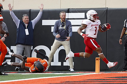 Sep 16, 2023; Stillwater, Oklahoma, USA; South Alabama Jaguars running back La'Damian Webb (3) runs past Oklahoma State Cowboys safety Trey Rucker (9) to score a touchdown at Boone Pickens Stadium. Mandatory Credit: Bryan Terry-USA TODAY Sports