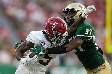 Sep 16, 2023; Tampa, Florida, USA;  Alabama Crimson Tide running back Roydell Williams (5) is tackled by South Florida Bulls safety Logan Berryhill (37) in the third quarter at Raymond James Stadium. Mandatory Credit: Nathan Ray Seebeck-USA TODAY Sports