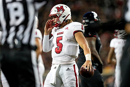 Miami (Oh) RedHawks quarterback Brett Gabbert (5) holds the ball between plays during the NCAA football game between the Cincinnati Bearcats and the Miami RedHawks at Nippert Stadium in Cincinnati on Saturday, Sept. 16, 2023.