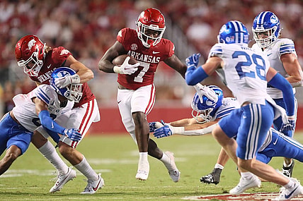 Sep 16, 2023; Fayetteville, Arkansas, USA; Arkansas Razorbacks running back Rashod Dubinion (7) rushes in the second quarter against the BYU Cougars at Donald W. Reynolds Razorback Stadium. Mandatory Credit: Nelson Chenault-USA TODAY Sports
