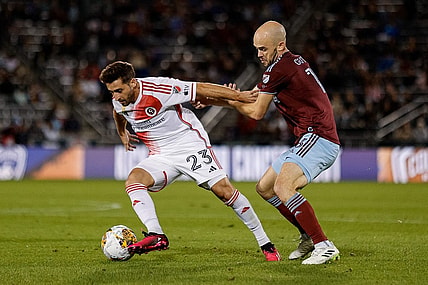 Sep 16, 2023; Commerce City, Colorado, USA; New England Revolution midfielder Nacho Gil (23) and Colorado Rapids defender Andrew Gutman (13) battle for the ball in the first half at Dick's Sporting Goods Park. Mandatory Credit: Isaiah J. Downing-USA TODAY Sports