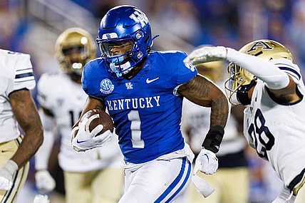 Sep 16, 2023; Lexington, Kentucky, USA; Kentucky Wildcats running back Ray Davis (1) carries the ball into the end zone and scores a touchdown during the fourth quarter against the Akron Zips at Kroger Field. Mandatory Credit: Jordan Prather-USA TODAY Sports