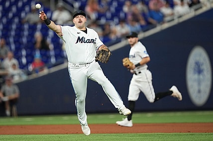 Sep 19, 2023; Miami, Florida, USA;  Miami Marlins third baseman Jake Burger (36) throws out New York Mets catcher Francisco Alvarez at first base in the first inning at loanDepot Park. Mandatory Credit: Jim Rassol-USA TODAY Sports
