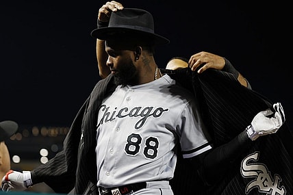 Sep 19, 2023; Washington, District of Columbia, USA; Chicago White Sox center fielder Luis Robert Jr. (88) is given the "Southside Jacket" by White Sox shortstop Elvis Andrus (1) after hitting a home run against the Washington Nationals during the fourth inning at Nationals Park. Mandatory Credit: Geoff Burke-USA TODAY Sports