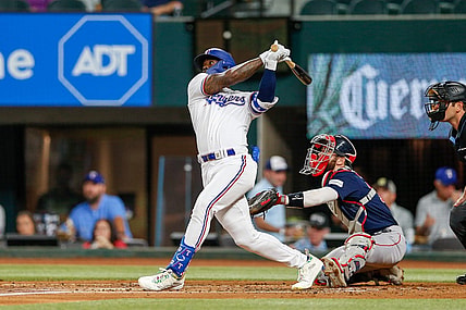 Sep 19, 2023; Arlington, Texas, USA; Texas Rangers right fielder Adolis Garcia hits a home run during the second inning against the Boston Red Sox at Globe Life Field. Mandatory Credit: Andrew Dieb-USA TODAY Sports