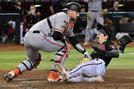 Sep 19, 2023; Phoenix, Arizona, USA; Arizona Diamondbacks left fielder Corbin Carroll (7) scores in the second inning against the San Francisco Giants at Chase Field. Mandatory Credit: Matt Kartozian-USA TODAY Sports