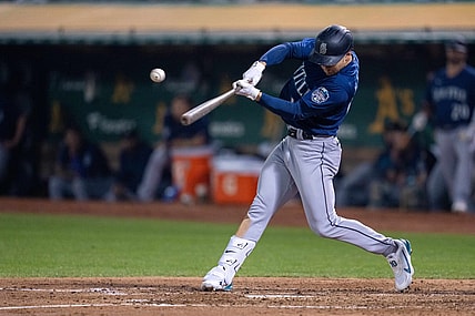 Sep 19, 2023; Oakland, California, USA; Seattle Mariners left fielder Jarred Kelenic (10) hits a RBI single against the Oakland Athletics during the fourth inning at Oakland-Alameda County Coliseum. Mandatory Credit: Neville E. Guard-USA TODAY Sports