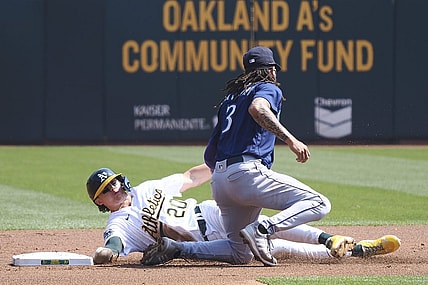 Sep 20, 2023; Oakland, California, USA; Oakland Athletics second baseman Zack Gelof (20) steals second base against Seattle Mariners shortstop J.P. Crawford (3) during the first inning at Oakland-Alameda County Coliseum. Mandatory Credit: Kelley L Cox-USA TODAY Sports