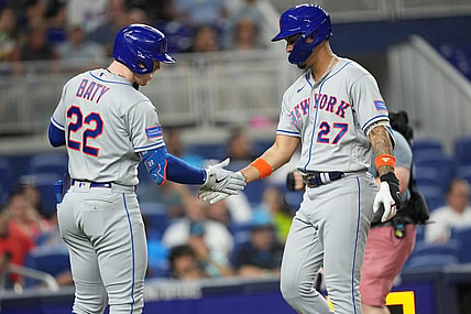 Sep 20, 2023; Miami, Florida, USA;  New York Mets designated hitter Mark Vientos (27) is congratulated by third baseman Brett Baty (22) after hitting a solo home run in the second inning against the Miami Marlins at loanDepot Park. Mandatory Credit: Jim Rassol-USA TODAY Sports