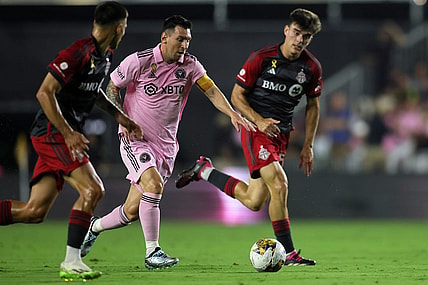 Sep 20, 2023; Fort Lauderdale, Florida, USA; Inter Miami forward Lionel Messi (10) kicks the ball past Toronto FC during the first half at DRV PNK Stadium. Mandatory Credit: Sam Navarro-USA TODAY Sports