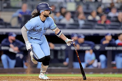 Sep 20, 2023; Bronx, New York, USA; Toronto Blue Jays shortstop Bo Bichette (11) follows through on an RBI single against the New York Yankees during the ninth inning at Yankee Stadium. Mandatory Credit: Brad Penner-USA TODAY Sports