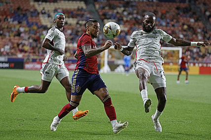 Sep 20, 2023; Sandy, Utah, USA; FC Dallas defender Sebastien Ibeagha (25) clears the ball from Real Salt Lake forward Chicho Arango (9) in the first half at America First Field. Mandatory Credit: Jeff Swinger-USA TODAY Sports