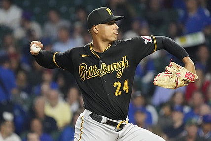 Sep 21, 2023; Chicago, Illinois, USA; Pittsburgh Pirates starting pitcher Johan Oviedo (24) throws the ball against the Chicago Cubs during the first inning at Wrigley Field. Mandatory Credit: David Banks-USA TODAY Sports