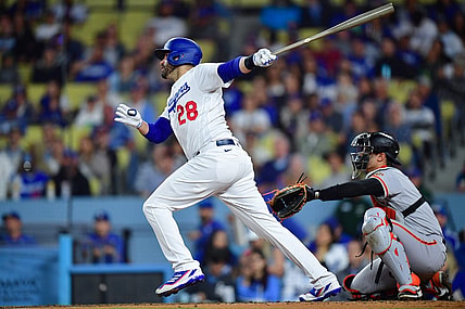 Sep 21, 2023; Los Angeles, California, USA; Los Angeles Dodgers designated hitter J.D. Martinez (28) hits a solo home run against the San Francisco Giants during the fourth inning at Dodger Stadium. Mandatory Credit: Gary A. Vasquez-USA TODAY Sports