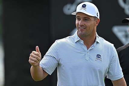 Sep 22, 2023; Sugar Grove, Illinois, USA; Bryson DeChambeau interacts with fans while warming up during the first round of the LIV Golf Chicago golf tournament at Rich Harvest Farms. Mandatory Credit: Jamie Sabau-USA TODAY Sports