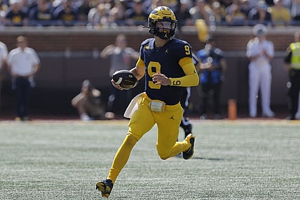 Sep 23, 2023; Ann Arbor, Michigan, USA;  Michigan Wolverines quarterback J.J. McCarthy (9) runs the ball against the Rutgers Scarlet Knights in the first half at Michigan Stadium. Mandatory Credit: Rick Osentoski-USA TODAY Sports