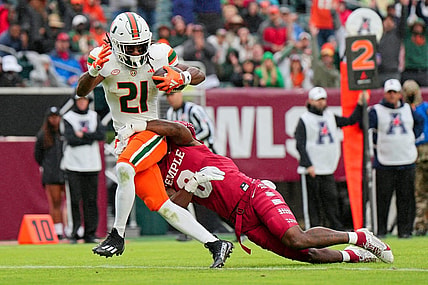 Sep 23, 2023; Philadelphia, Pennsylvania, USA;  Temple Owls safety Alex Odom (8) can   t stop Miami Hurricanes running back Henry Parrish Jr. (21) from scoring a touchdown in the second half against the Temple Owls at Lincoln Financial Field. Mandatory Credit: Andy Lewis-USA TODAY Sports