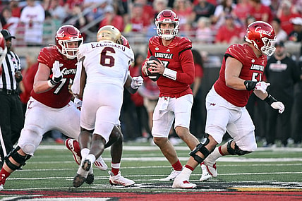 Sep 23, 2023; Louisville, Kentucky, USA;  Louisville Cardinals quarterback Jack Plummer (13) looks to pass againt the Boston College Eagles during the second half at L&N Federal Credit Union Stadium. Louisville defeated Boston College 56-28. Mandatory Credit: Jamie Rhodes-USA TODAY Sports