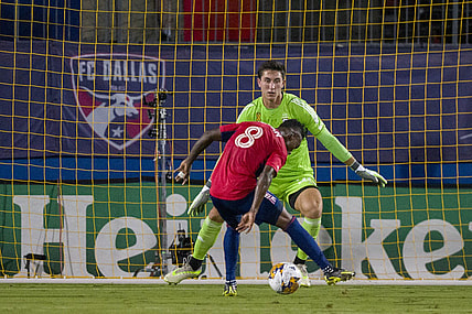 Sep 23, 2023; Frisco, Texas, USA; Columbus Crew goalkeeper Patrick Schulte (28) stops a shot by FC Dallas forward Jader Obrian (8) during the first half at Toyota Stadium. Mandatory Credit: Jerome Miron-USA TODAY Sports