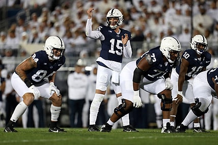 Sep 23, 2023; University Park, Pennsylvania, USA; Penn State Nittany Lions quarterback Drew Allar (15) gestures from the line of scrimmage during the first quarter against the Iowa Hawkeyes at Beaver Stadium. Mandatory Credit: Matthew O'Haren-USA TODAY Sports