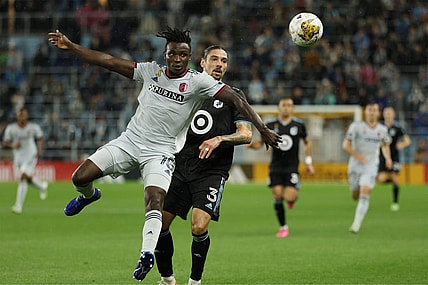 Sep 23, 2023; Saint Paul, Minnesota, USA; St. Louis City SC defender Joshua Yaro (15) battles Minnesota United FC defender Zarek Valentin (3) for the ball in the first half at Allianz Field. Mandatory Credit: Matt Krohn-USA TODAY Sports