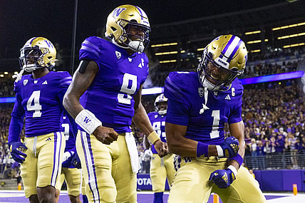 Sep 23, 2023; Seattle, Washington, USA; Washington Huskies wide receiver Rome Odunze (1) celebrates with quarterback Michael Penix Jr. (9) after returning a punt for a touchdown during the first quarter at Alaska Airlines Field at Husky Stadium. Mandatory Credit: Joe Nicholson-USA TODAY Sports