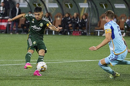 Sep 23, 2023; Portland, Oregon, USA; Portland Timbers forward Felipe Mora (9) takes a shot on goal during the second half against Colorado Rapids defender Andreas Maxso (5) at Providence Park. Mandatory Credit: Troy Wayrynen-USA TODAY Sports