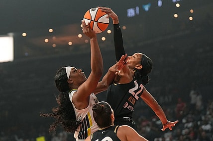 Sep 24, 2023; Las Vegas, Nevada, USA; Las Vegas Aces center A'ja Wilson (22) blocks a jump shot by Dallas Wings center Teaira McCowan (7) during the first half of game one of the 2023 WNBA Playoffs at Michelob Ultra Arena. Mandatory Credit: Kirby Lee-USA TODAY Sports