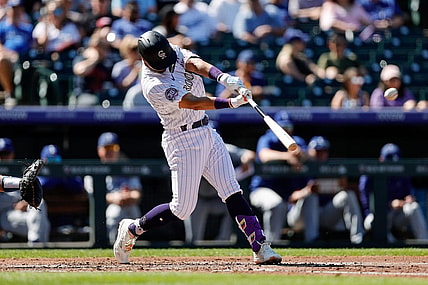 -Sep 26, 2023; Denver, Colorado, USA; Colorado Rockies shortstop Ezequiel Tovar (14) hits a double in the second inning against the Los Angeles Dodgers at Coors Field. Mandatory Credit: Isaiah J. Downing-USA TODAY Sports