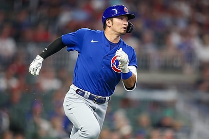 Sep 26, 2023; Atlanta, Georgia, USA; Chicago Cubs right fielder Seiya Suzuki (27) hits a two-run triple against the Atlanta Braves in the third inning at Truist Park. Mandatory Credit: Brett Davis-USA TODAY Sports