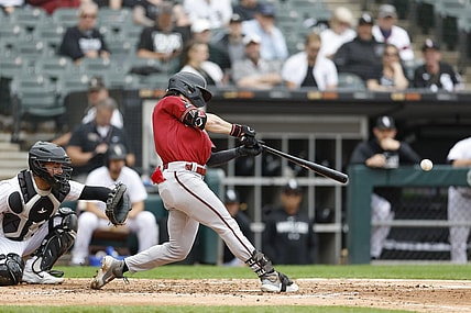 Sep 27, 2023; Chicago, Illinois, USA; Arizona Diamondbacks left fielder Corbin Carroll (7) hits a two-run double against the Chicago White Sox during the third inning at Guaranteed Rate Field. Mandatory Credit: Kamil Krzaczynski-USA TODAY Sports