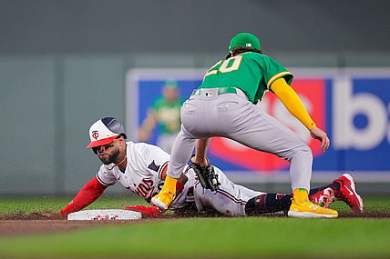 Sep 27, 2023; Minneapolis, Minnesota, USA; Minnesota Twins center fielder Willi Castro (50) steals second base against the Oakland Athletics second baseman Zack Gelof (20) in the second inning at Target Field. Mandatory Credit: Brad Rempel-USA TODAY Sports