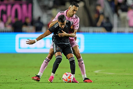Sep 27, 2023; Fort Lauderdale, FL, USA; Houston Dynamo midfielder Amine Bassi (8) battles for the ball against Inter Miami CF midfielder Sergio Busquets (5) during the first half at DRV PNK Stadium. Mandatory Credit: Sam Navarro-USA TODAY Sports