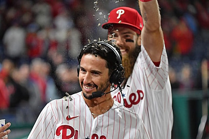 Sep 27, 2023; Philadelphia, Pennsylvania, USA; Philadelphia Phillies catcher Garrett Stubbs (21) has sunflower seeds dumped on him by center fielder Brandon Marsh (16) after win against the Pittsburgh Pirates at Citizens Bank Park. Mandatory Credit: Eric Hartline-USA TODAY Sports