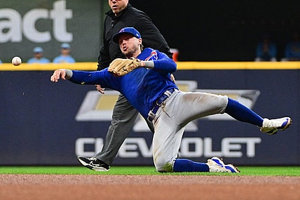 Sep 29, 2023; Milwaukee, Wisconsin, USA; Chicago Cubs second baseman Nico Hoerner (2) throws out Milwaukee Brewers first baseman Carlos Santana (not pictured) in the fourth inning at American Family Field. Mandatory Credit: Benny Sieu-USA TODAY Sports