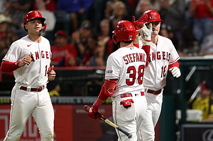 Sep 29, 2023; Anaheim, California, USA;  Los Angeles Angels center fielder Mickey Moniak (16) is greeted by third baseman Michael Stefanic (38) after hitting a home run during the fifth inning against the Oakland Athletics at Angel Stadium. Mandatory Credit: Kiyoshi Mio-USA TODAY Sports