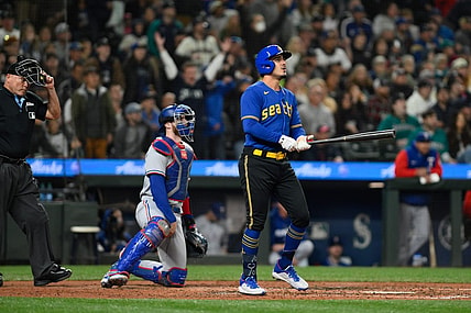 Sep 29, 2023; Seattle, Washington, USA; Seattle Mariners second baseman Josh Rojas (4) hits a home run against the Texas Rangers during the third inning at T-Mobile Park. Mandatory Credit: Steven Bisig-USA TODAY Sports